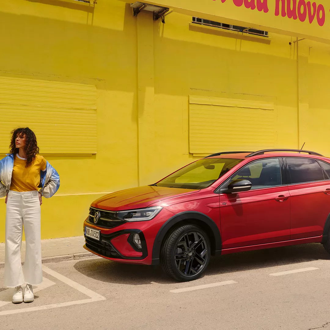 TA0048-taigo-exterior-red-side-view-woman-next-to-car